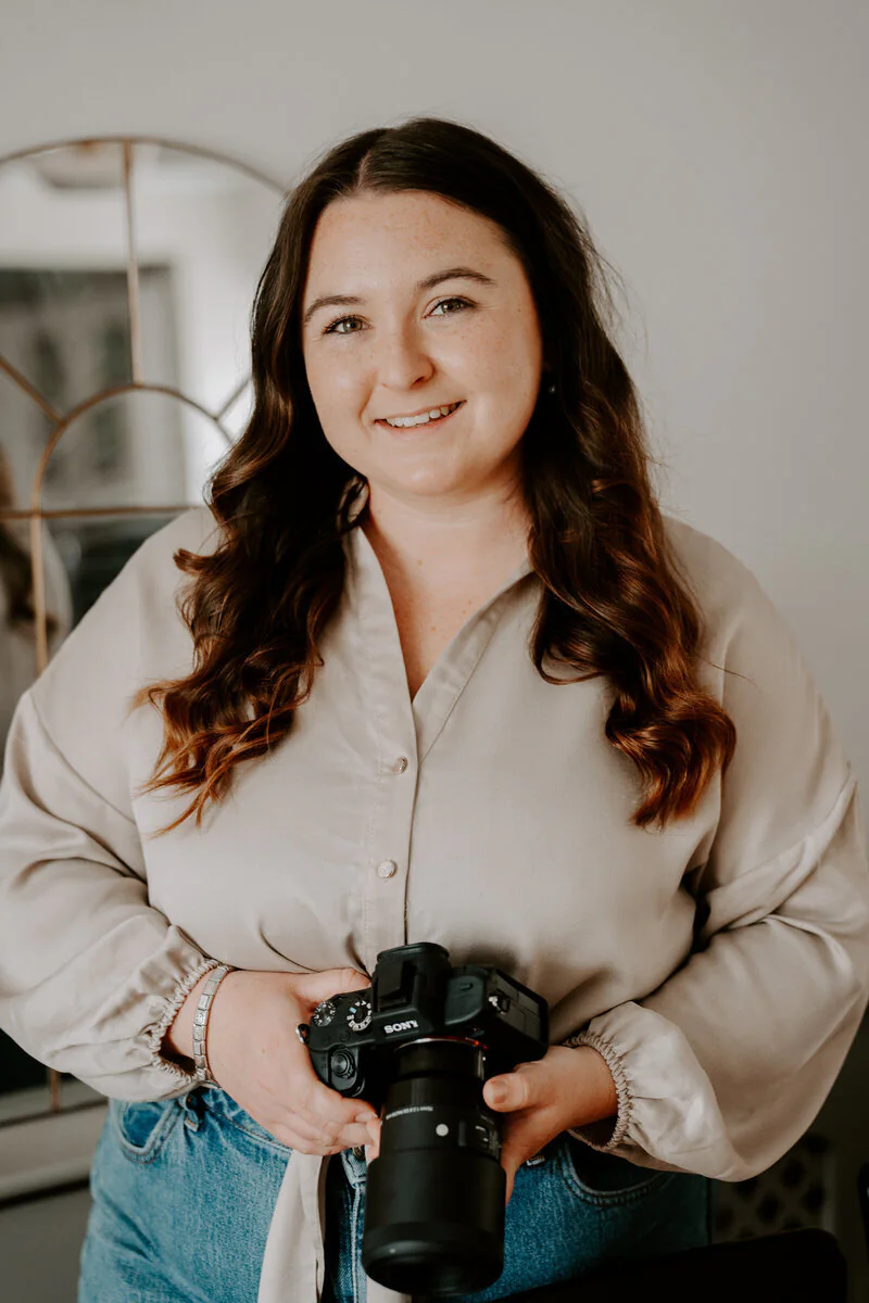 Beth holding her camera