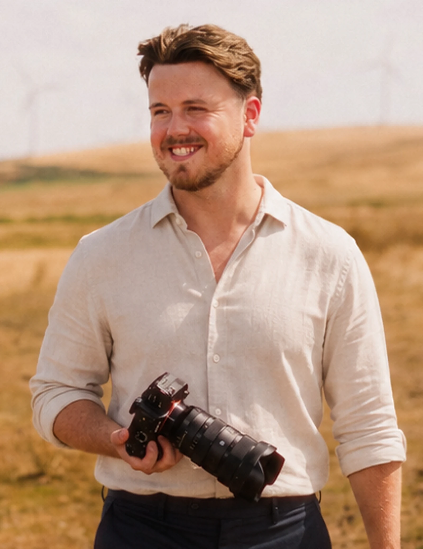 Cam holding a camera on the coast