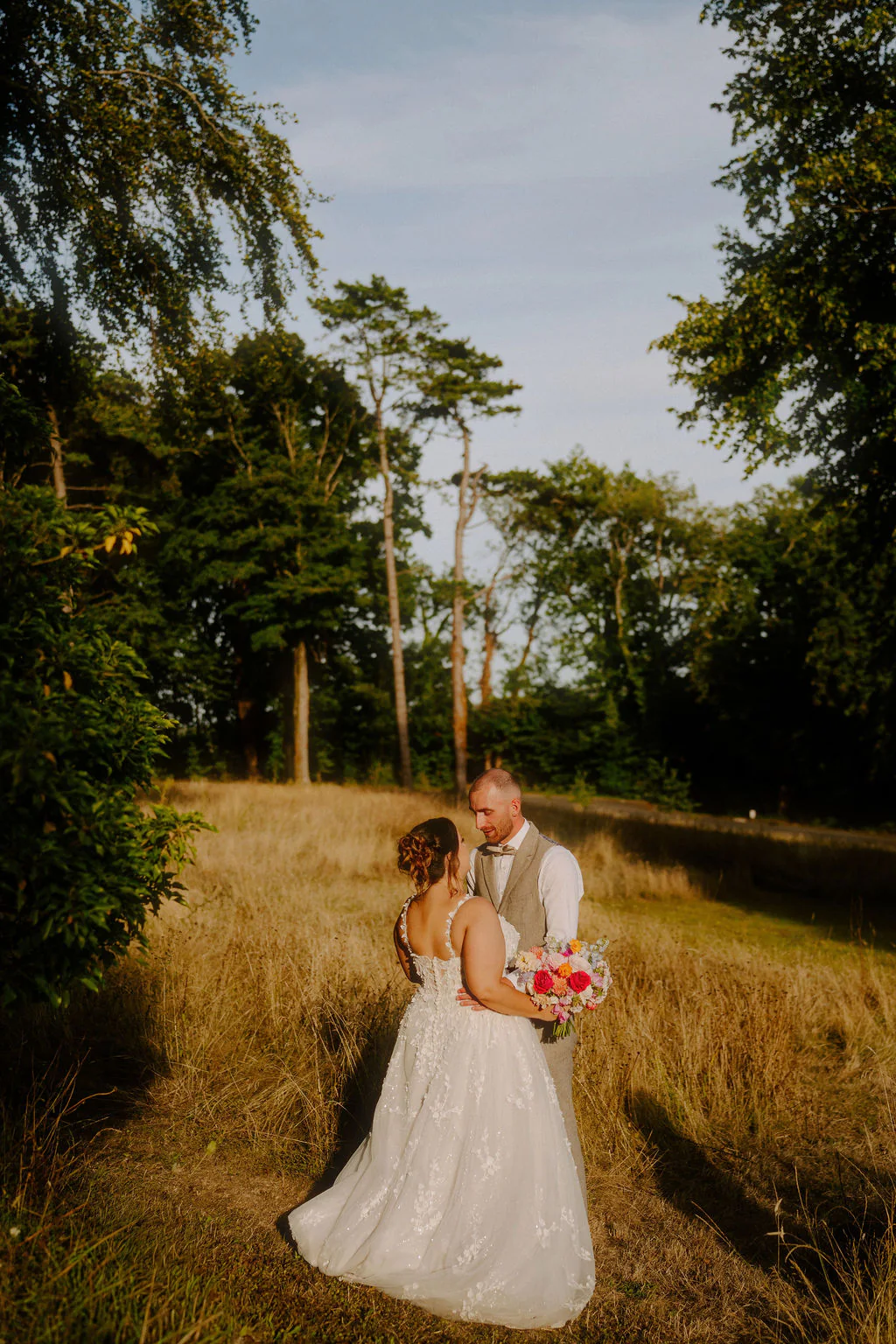 Coed-Y-Mwstwr Hotel Wedding Photographer & Videographer | Coychurch Laura and Jordan romantic evening portrait on the lawn at Coed-Y-Mwstwr Hotel