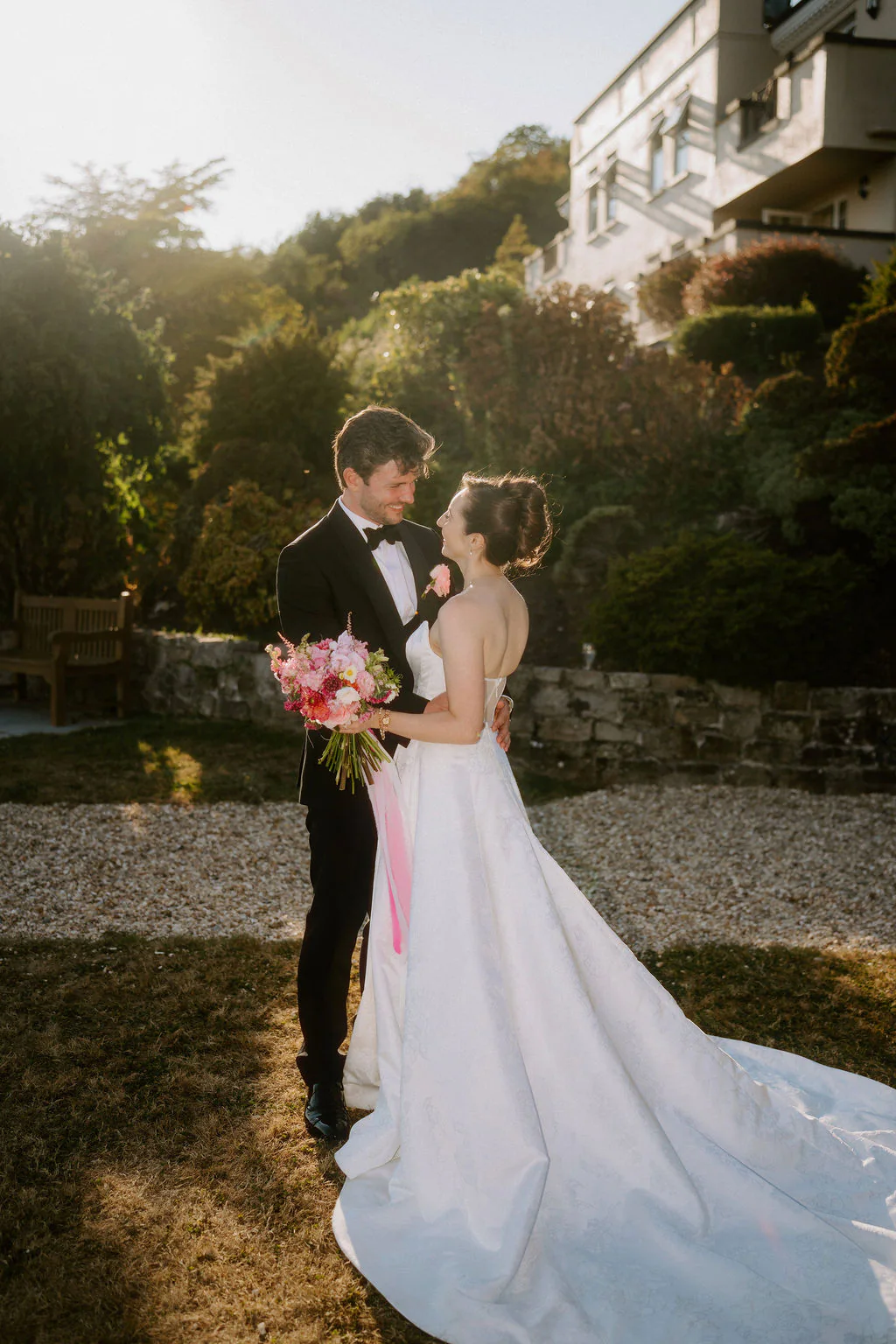 New House Country Hotel Golden Hour | Thornhill Louisa and Chris smiling during their golden hour couple walk at New House Country Hotel