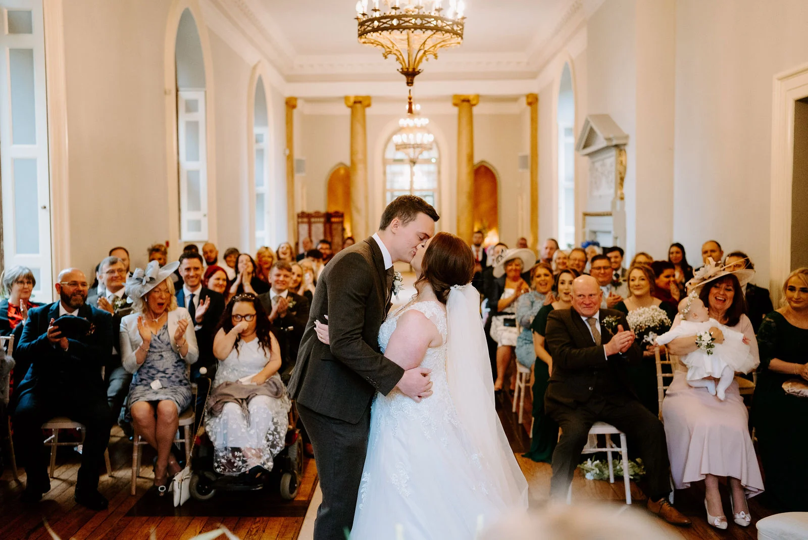 Zoe & Cory | Ballroom Ceremony Zoe and Cory ceremony first kiss inside the Gothic ballroom at Clearwell Castle