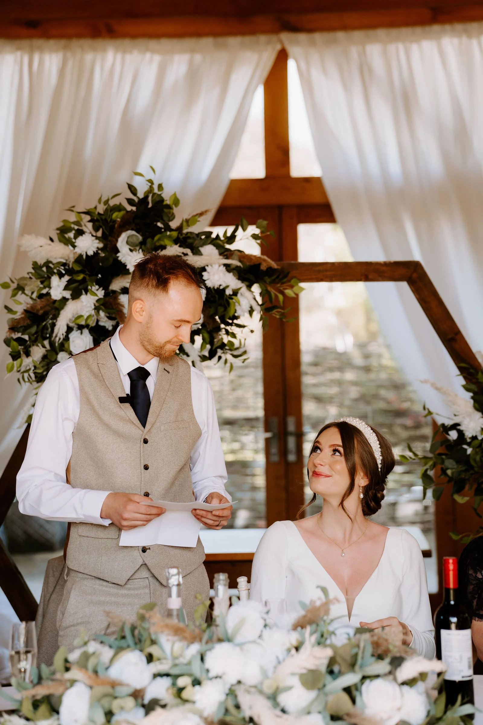Harriet & Kyle | Courtyard Moments Natural smiles and candid laughter in the courtyard at The Barn at Upcote