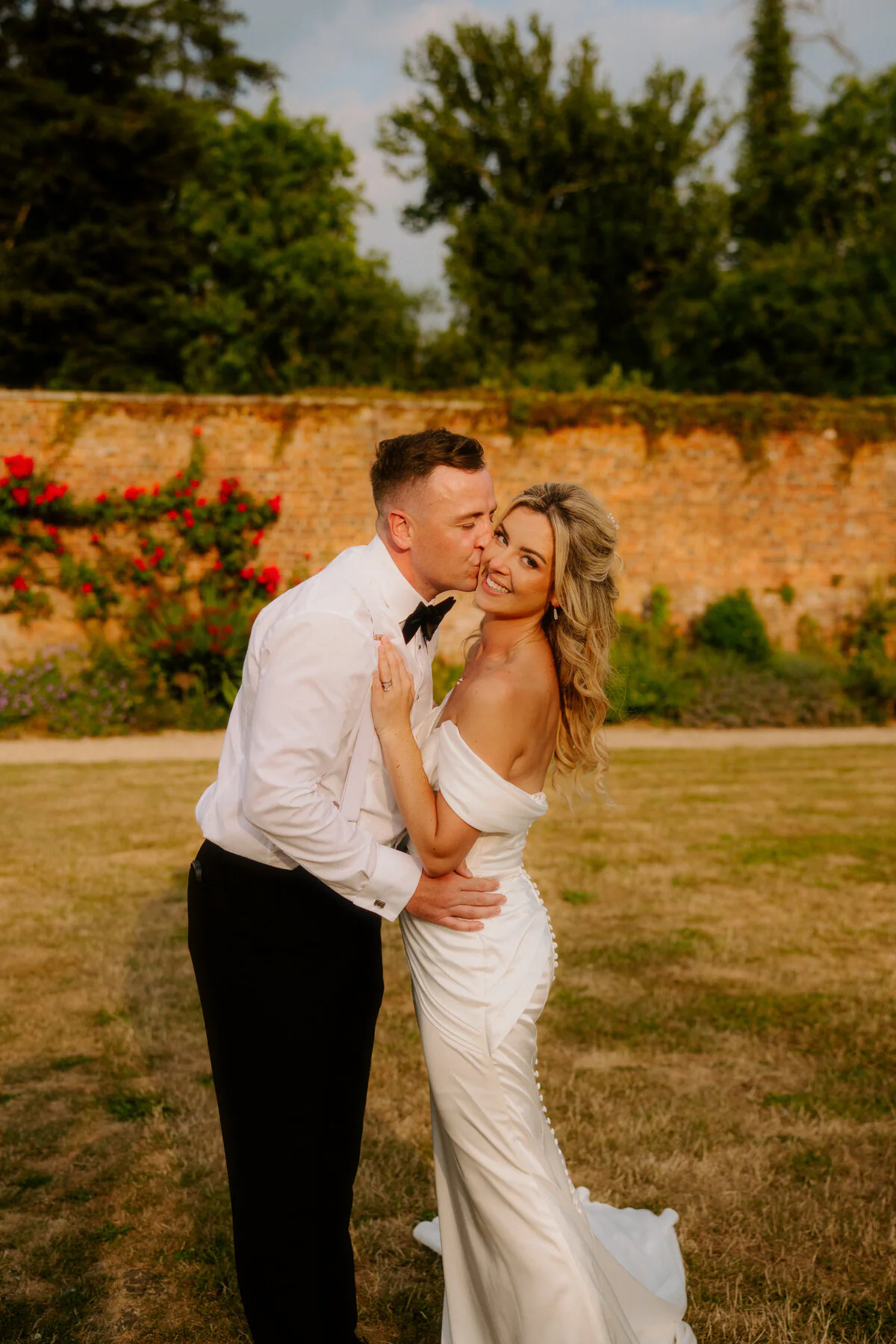 Ca104280 Edit Bride and groom walking together outdoors during natural Bristol wedding photography.