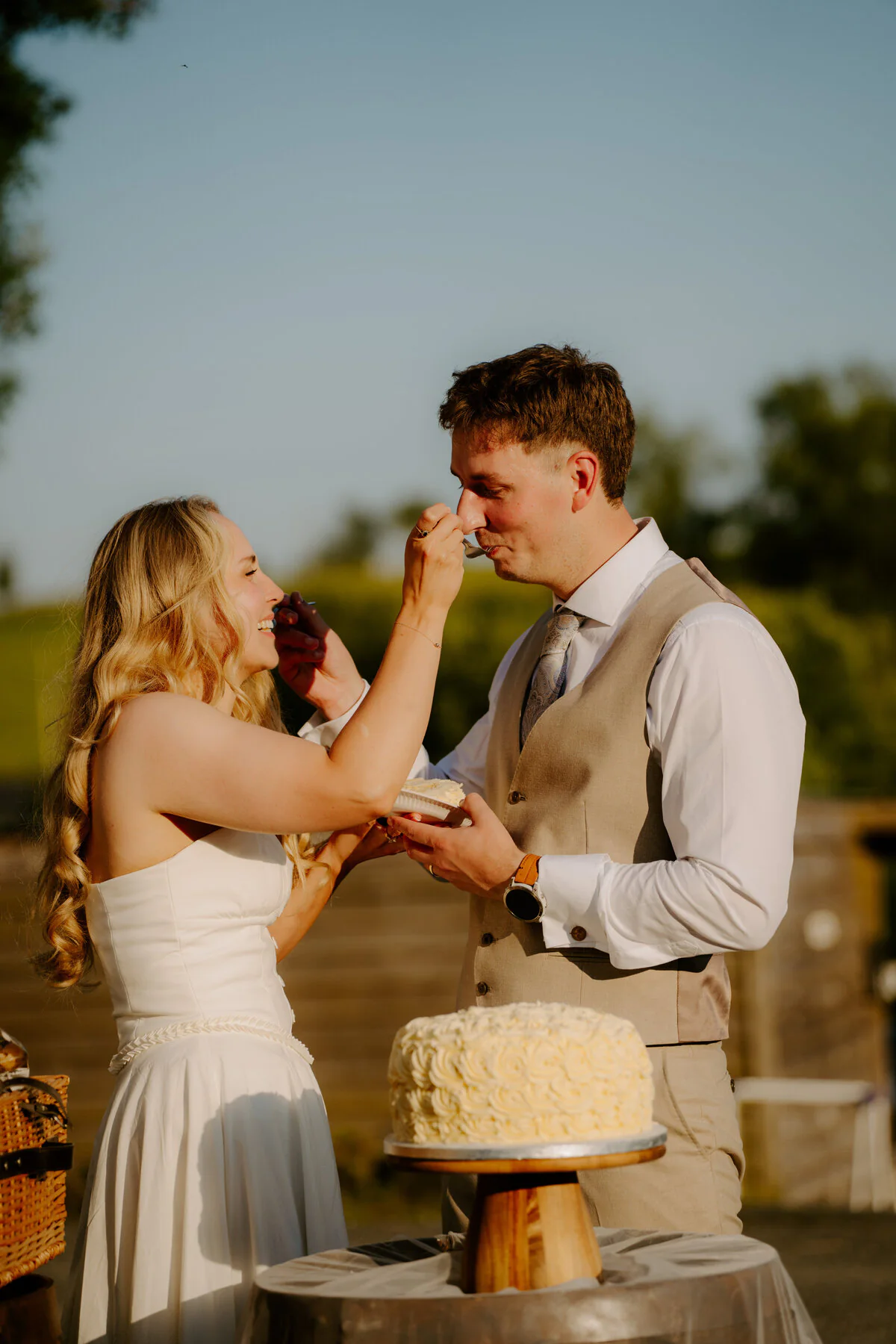 Ca109643 Newlyweds walking together at golden hour, photographed by a Gloucester wedding photographer.