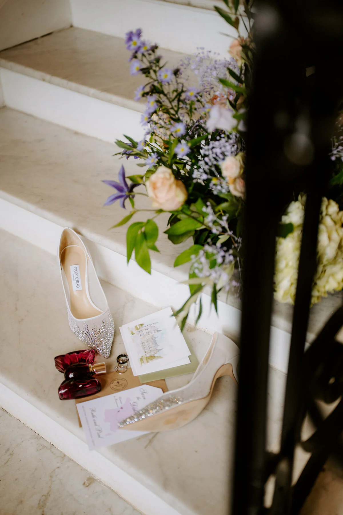 Dsc06339 Bridal shoes, flowers and wedding stationery arranged on a staircase.