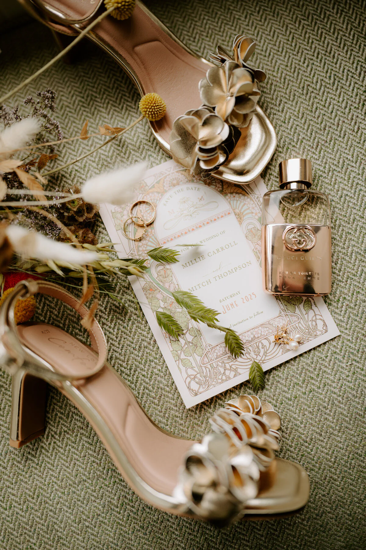 Dsc02383 Wedding flat lay with gold heels, rings, perfume and Millie and Mitch's save-the-date card.