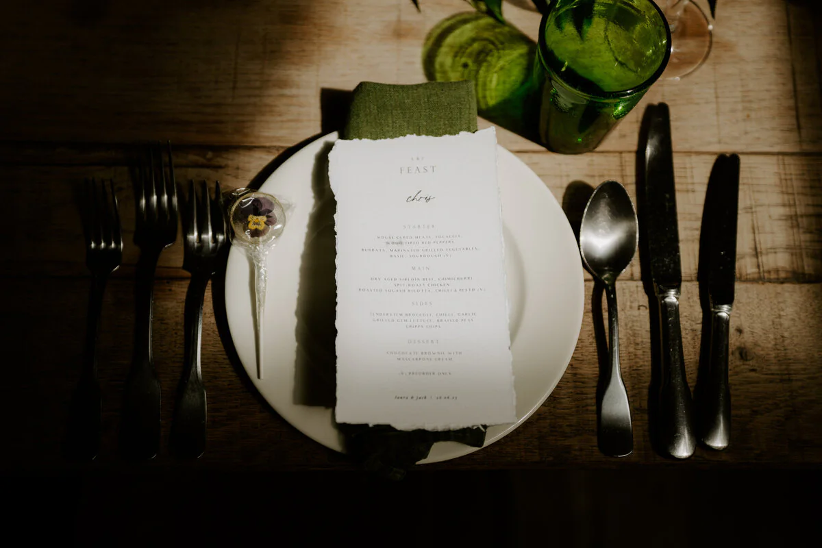 Dsc07511 Close-up of a wedding menu on a rustic table setting.