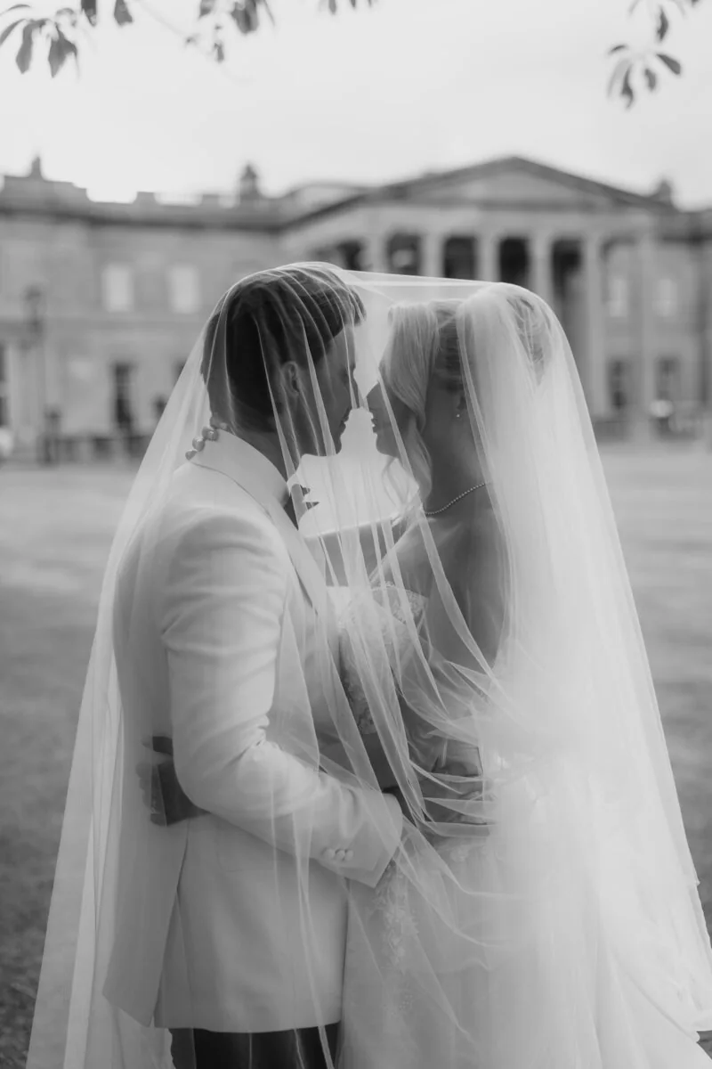 A candid wedding moment outside a country house