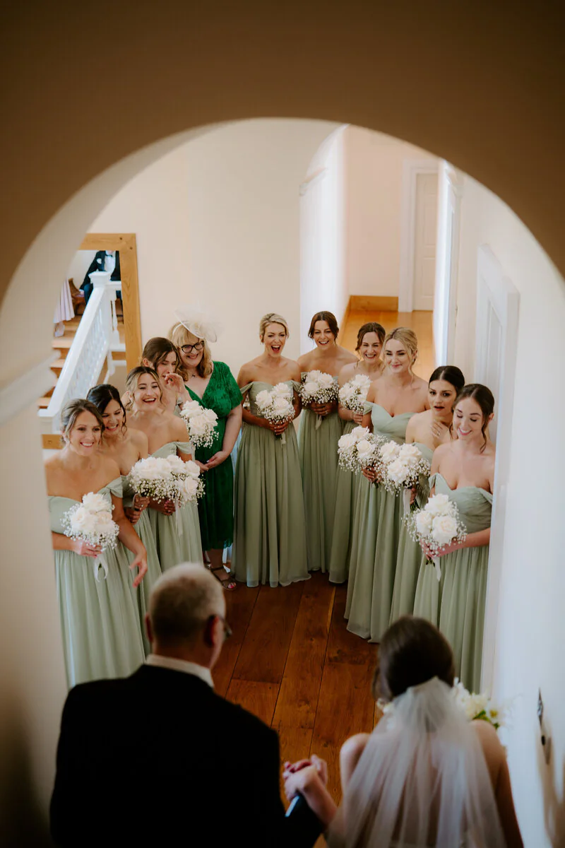 A joyful confetti moment after a wedding ceremony
