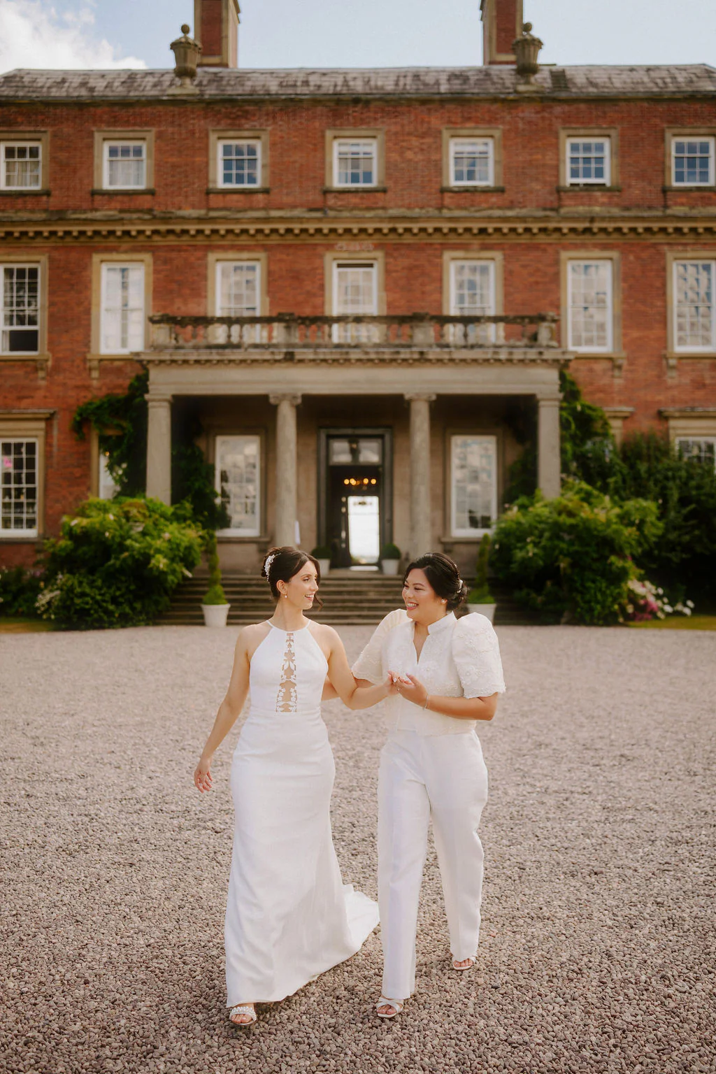 Davenport House Wedding Photography | Bridgnorth Anna & Emilyn enjoying drinks with guests on the lawn at Davenport House in Shropshire