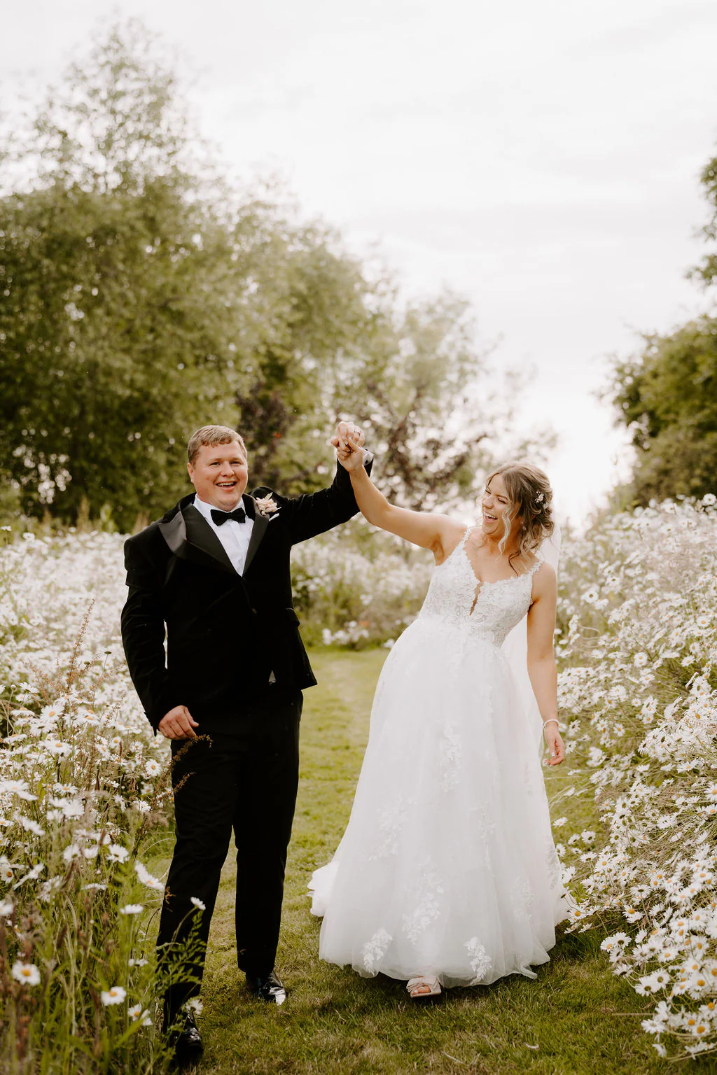 Blackwell Grange Wedding Photographer & Videographer | Warwickshire Caitlin & Tom relaxed couple portrait by the thatched stone barn at Blackwell Grange in Warwickshire