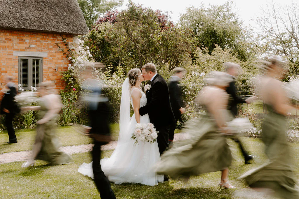 Blackwell Grange Evening Atmosphere | Warwickshire Caitlin & Tom walking across the moonlit lawn at Blackwell Grange during their evening wedding party