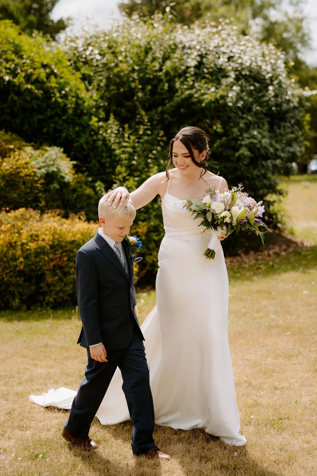 Draycote Hotel Wedding Couple Portrait | Rugby Alison & Kieran walking hand-in-hand through the lakeside gardens at Draycote Hotel
