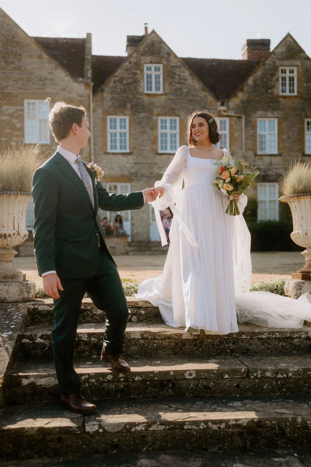 Talton House Wedding Photography | Stratford-upon-Avon Taylor & Brodie walking hand-in-hand through the private grounds at Talton House in Warwickshire