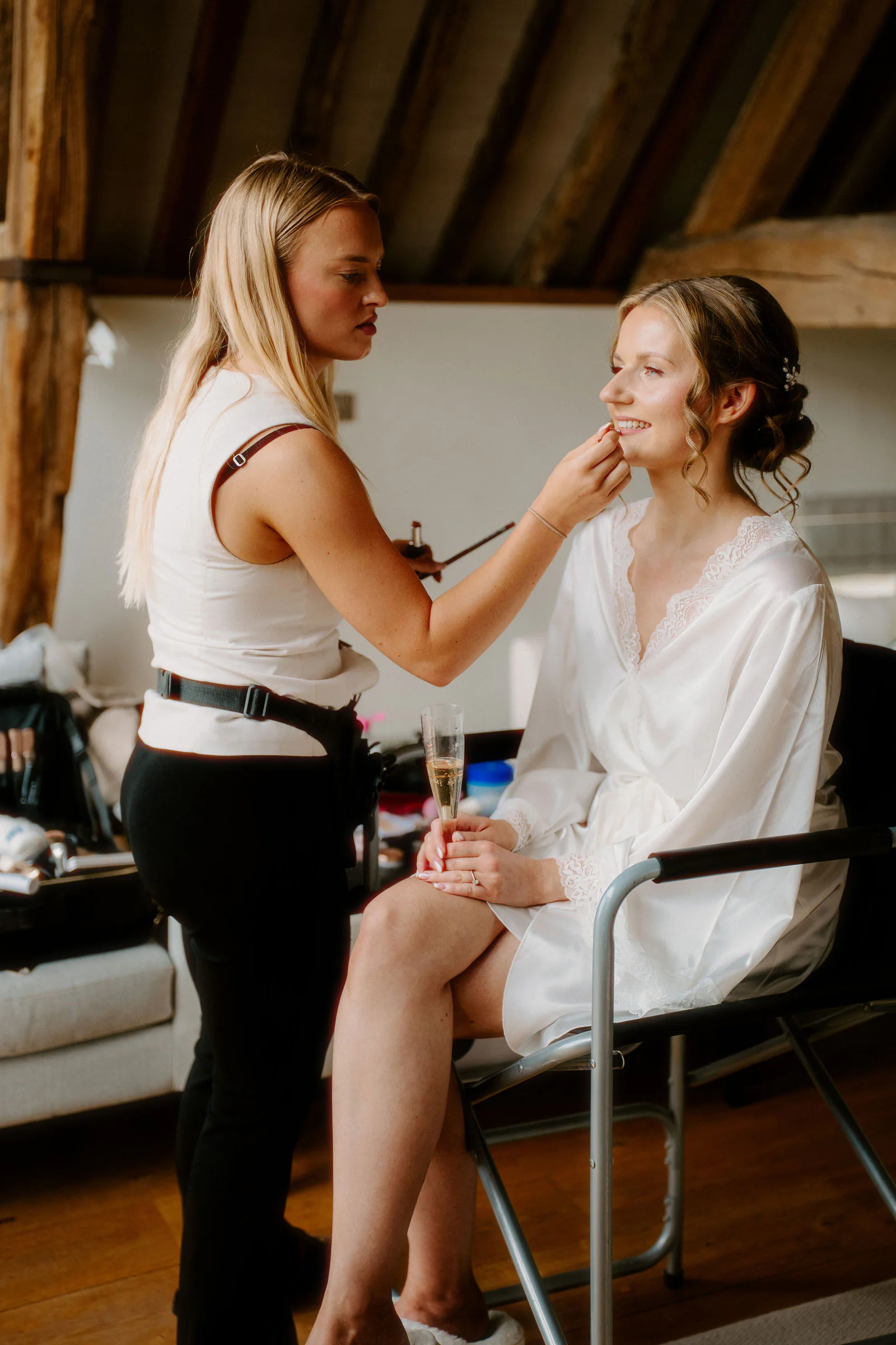 Bowerchalke Barn Bridal Preparations | Wiltshire Vanessa bridal portrait illuminated by soft natural light inside Bowerchalke Barn